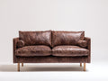 Zweisitzer Sofa - Bezug in Lederoptik 184x88x83 cm - Dunkelbraun - Modernes Design mit geraden Armlehnen und erhöhtem Untergestell